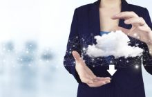 Two hand holding virtual holographic cloud, download, data icon with light blurred background. Cloud computing technology internet concept background